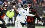 Dec 7, 2025; Cleveland, Ohio, USA; Tennessee Titans quarterback Cam Ward (1) throws a pass as Cleveland Browns linebacker Devin Bush (30) rushes during the fourth quarter at Huntington Bank Field. Mandatory Credit: Ken Blaze-Imagn Images