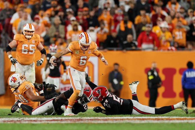 Dec 11, 2025; Tampa, Florida, USA; Atlanta Falcons linebacker James Pearce Jr. (27) and defensive tackle Brandon Dorlus (54) sack Tampa Bay Buccaneers quarterback Baker Mayfield (6) during the second quarter at Raymond James Stadium. Mandatory Credit: Nathan Ray Seebeck-Imagn Images