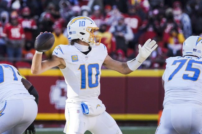 Dec 14, 2025; Kansas City, Missouri, USA; Los Angeles Chargers quarterback Justin Herbert (10) passes against the Kansas City Chiefs during the second quarter at GEHA Field at Arrowhead Stadium. Mandatory Credit: Denny Medley-Imagn Images