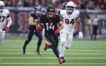 Dec 14, 2025; Houston, Texas, USA; Houston Texans wide receiver Jaylin Noel (14) returns a kickoff during the game against the Arizona Cardinals at NRG Stadium. Mandatory Credit: Troy Taormina-Imagn Images