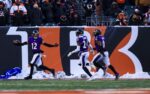 Dec 14, 2025; Cincinnati, Ohio, USA; Baltimore Ravens safety Alohi Gilman (12) reacts after returning an interception for a touchdown against the Cincinnati Bengals in the second half at Paycor Stadium. Mandatory Credit: Katie Stratman-Imagn Images