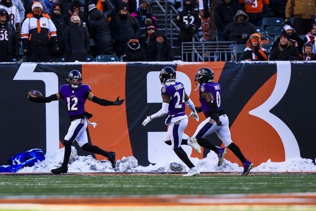 Dec 14, 2025; Cincinnati, Ohio, USA; Baltimore Ravens safety Alohi Gilman (12) reacts after returning an interception for a touchdown against the Cincinnati Bengals in the second half at Paycor Stadium. Mandatory Credit: Katie Stratman-Imagn Images