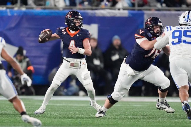 Dec 6, 2025; Charlotte, NC, USA; Virginia Cavaliers quarterback Chandler Morris (4) looks to throw during the second quarter against the Duke Blue Devils during the 2025 ACC Championship game at Bank of America Stadium. Mandatory Credit: Jim Dedmon-Imagn Images