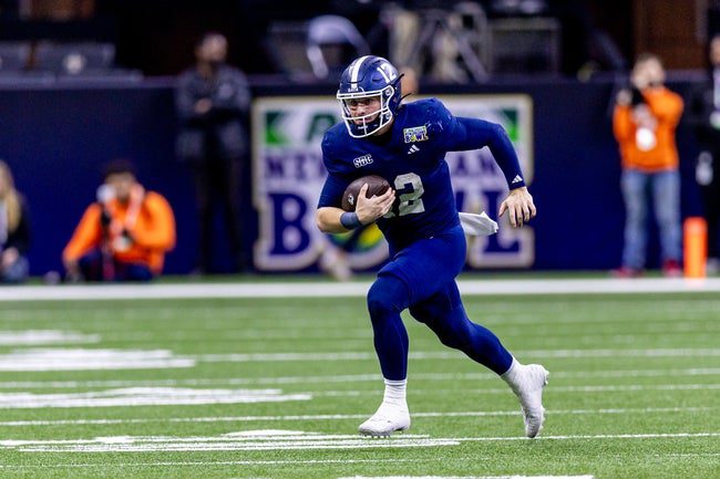 Dec 19, 2024; New Orleans, LA, USA; Georgia Southern Eagles quarterback JC French (12) scrambles out the pocket against the Sam Houston State Bearkats during the second half at Caesars Superdome. Mandatory Credit: Stephen Lew-Imagn Images