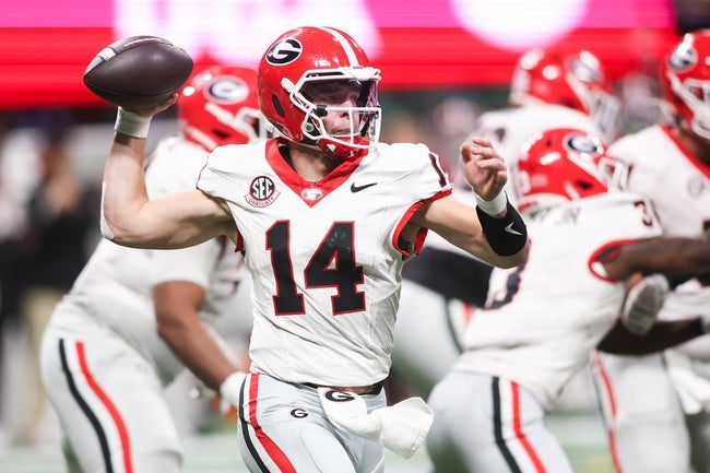 Dec 6, 2025; Atlanta, GA, USA; Georgia Bulldogs quarterback Gunner Stockton (14) throws a pass during the fourth quarter against the Alabama Crimson Tide during the 2025 SEC Championship game at Mercedes-Benz Stadium. Mandatory Credit: Brett Davis-Imagn Images