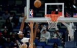 Dec 2, 2025; New Orleans, Louisiana, USA; New Orleans Pelicans center Derik Queen (22) hits the backboard as he makes a shot against Minnesota Timberwolves center Rudy Gobert (27) during overtime at Smoothie King Center. Mandatory Credit: Matthew Hinton-Imagn Images