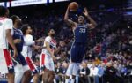 Dec 2, 2025; Philadelphia, Pennsylvania, USA; Philadelphia 76ers forward Jabari Walker (33) drives to shoot against the Washington Wizards in the fourth quarter at Xfinity Mobile Arena. Mandatory Credit: Kyle Ross-Imagn Images