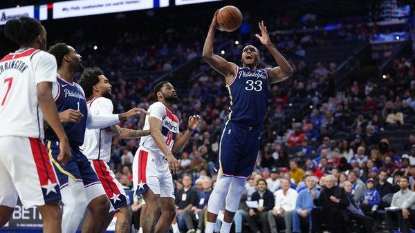 Dec 2, 2025; Philadelphia, Pennsylvania, USA; Philadelphia 76ers forward Jabari Walker (33) drives to shoot against the Washington Wizards in the fourth quarter at Xfinity Mobile Arena. Mandatory Credit: Kyle Ross-Imagn Images
