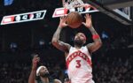 Dec 2, 2025; Toronto, Ontario, CAN; Toronto Raptors forward Brandon Ingram (3) dunks for a basket above Portland Trail Blazers forward Jerami Grant (9) in the second half at Scotiabank Arena. Mandatory Credit: Dan Hamilton-Imagn Images