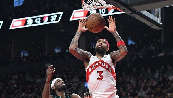 Dec 2, 2025; Toronto, Ontario, CAN; Toronto Raptors forward Brandon Ingram (3) dunks for a basket above Portland Trail Blazers forward Jerami Grant (9) in the second half at Scotiabank Arena. Mandatory Credit: Dan Hamilton-Imagn Images