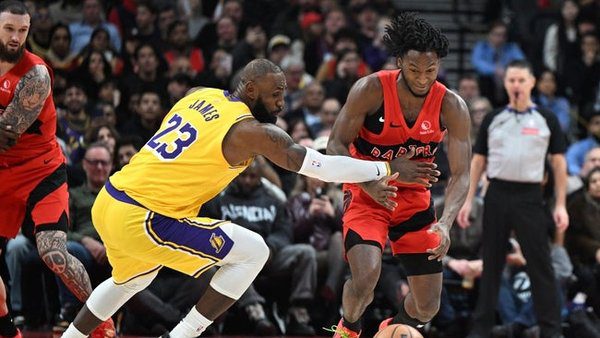 Dec 4, 2025; Toronto, Ontario, CAN; Toronto Raptors guard Immanuel Quickley (5) steals the ball from Los Angeles Lakers forward LeBron James (23) in the second half at Scotiabank Arena. Mandatory Credit: Dan Hamilton-Imagn Images